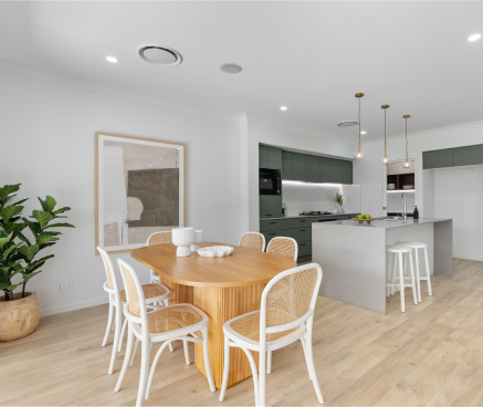 Stylish dining area and open-plan kitchen with modern design in the Capri Narrow-Lot Single-Storey home by King Homes NSW."
